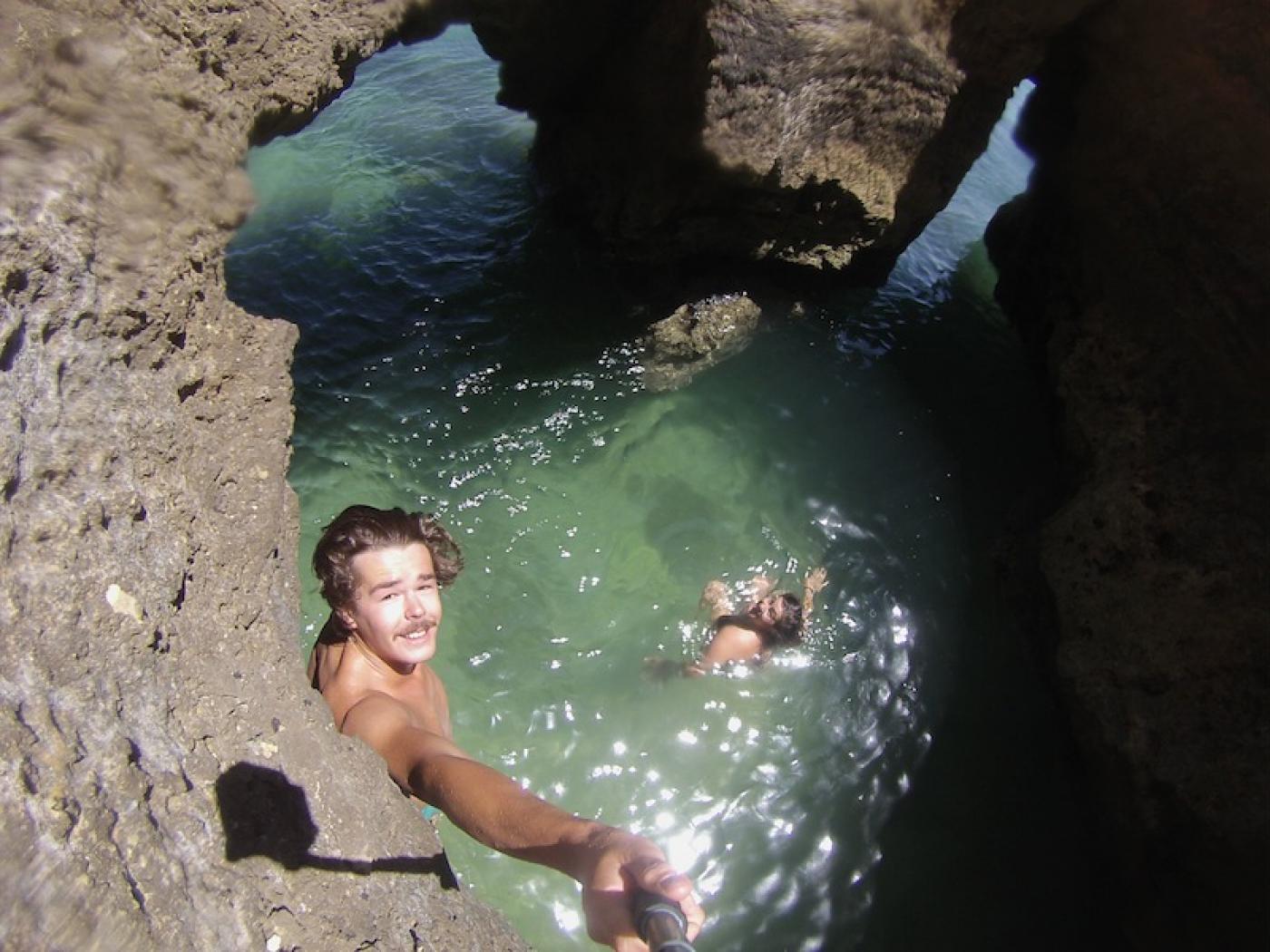 Natalie and her boyfriend explore a grotto in Lagos, Portugal.