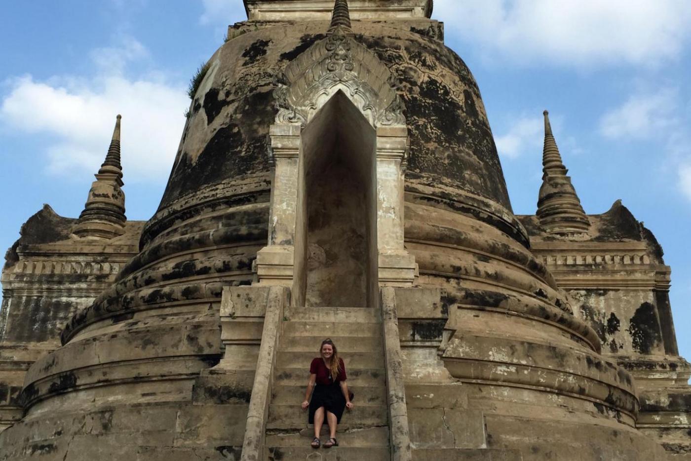 Kelly sits on the ruins of Wat Phra Si Sanphet in Ayutthaya, Thailand.