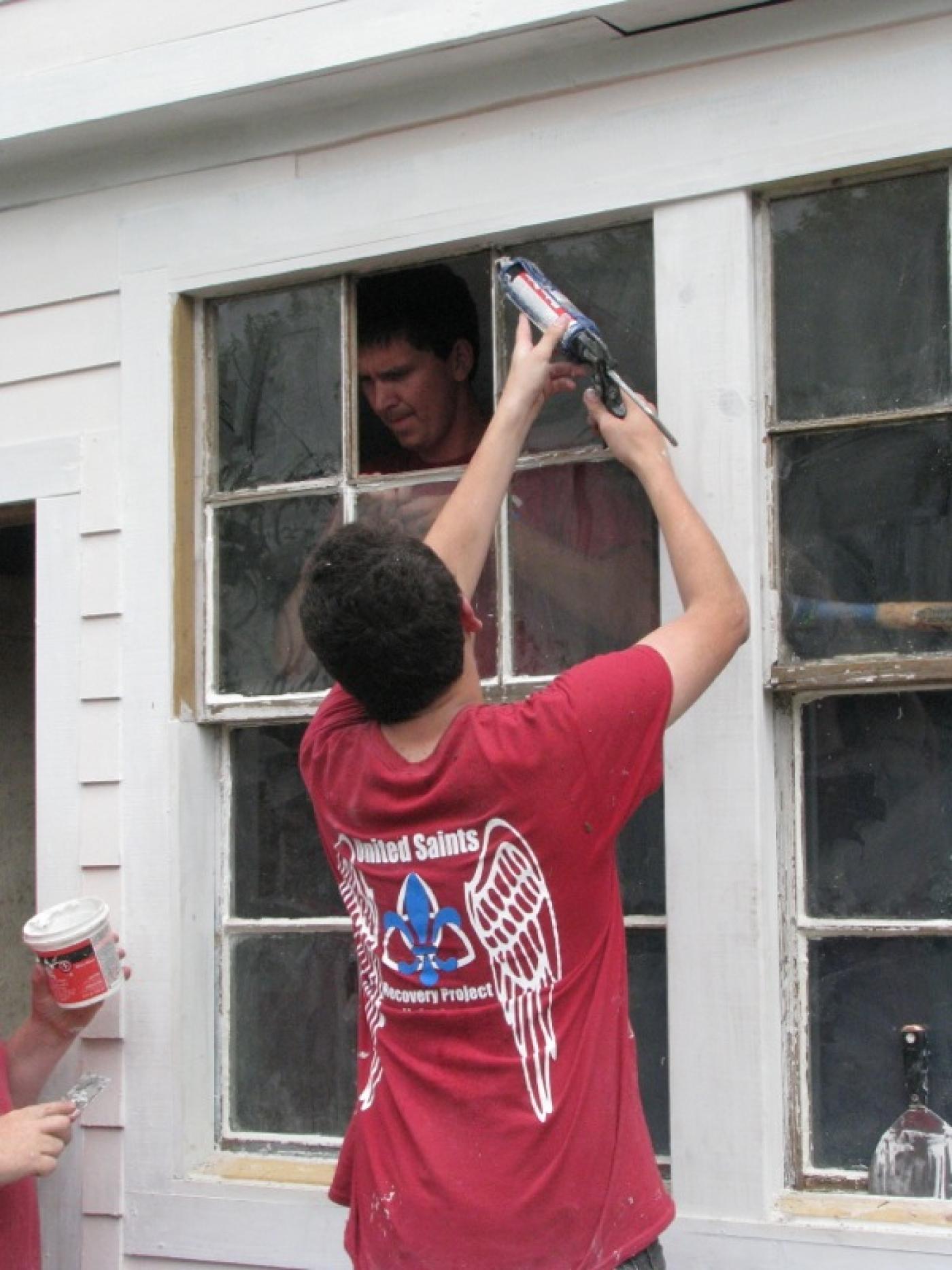 United Saints volunteers complete work on a house in New Orleans.