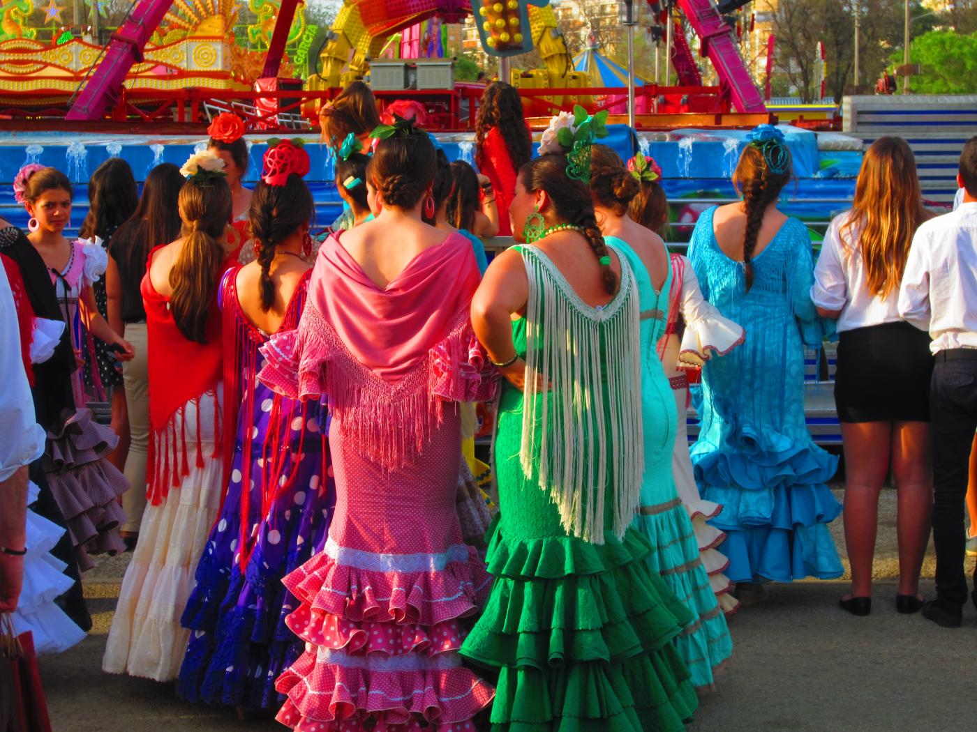 Andalusian women dressed in the traditional &quot;traje de gitana&quot; during the annual Seville Spring Fair.