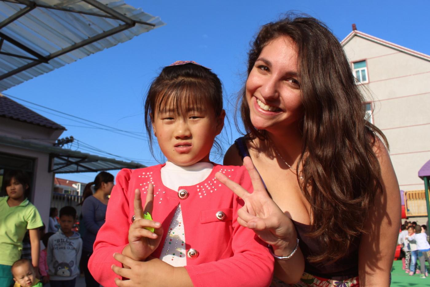 Rebecca poses with a local girl during in internship in Shanghai. &quot;I was definitely the more excited party in this interaction,&quot; says Shapiro.