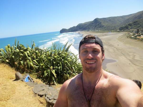 Eric stands atop Lion Rock at Piha Beach in New Zealand.