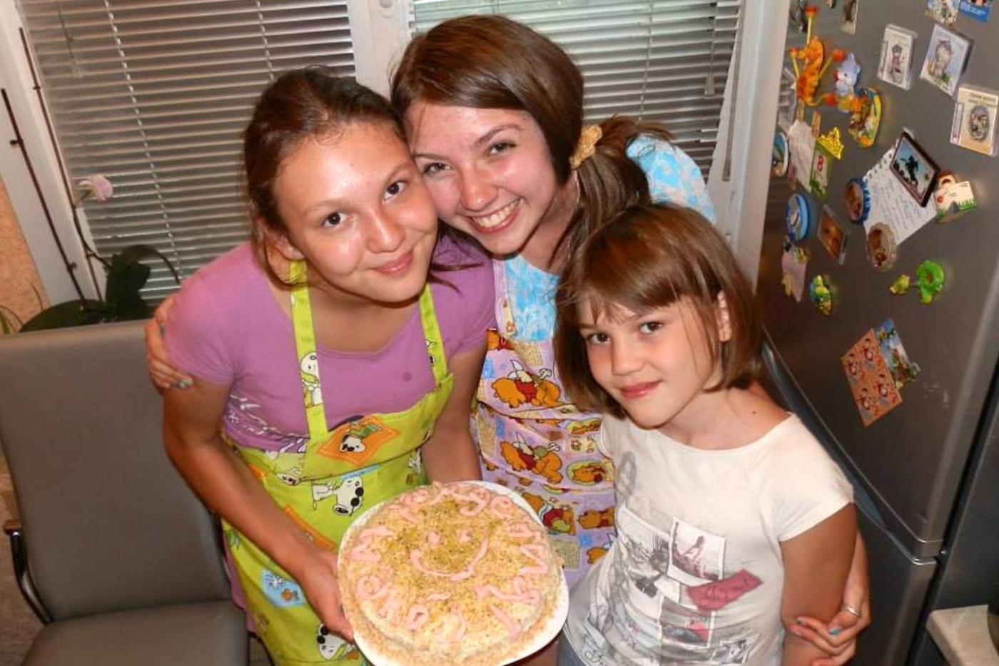 The writer, Katrina, with her Russian host sisters.  