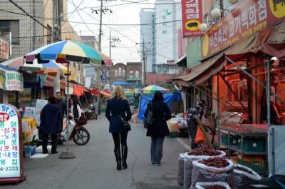 Melissa walks down the street during her year teaching English in Korea.
