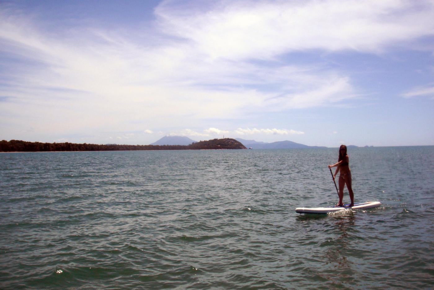 Taylor tries her hand at stand-up paddleboarding.