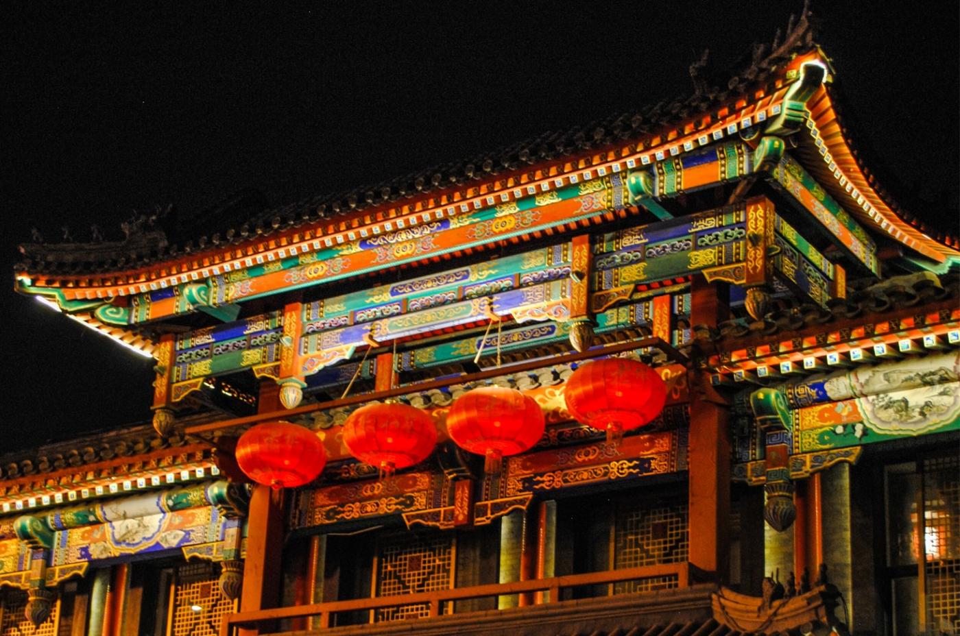 Beijing&#039;s rooftops light up the sky.