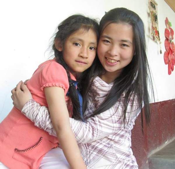 Leah poses with a girl at the orphanage.