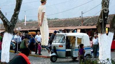 A slackliner in Antigua, Guatemala, performs for donations. (Photo credit: Trina Moyles.)