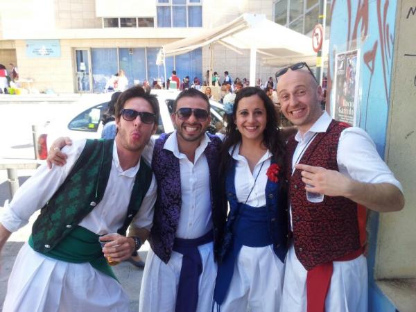 Andrew (right) poses with friends at a Spanish fiesta.