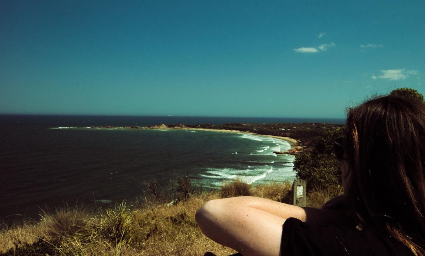 Taylor looks out over the Great Ocean Road, Australia.