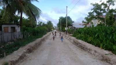Children dance outside in the streets of Cove and John, Guyana.