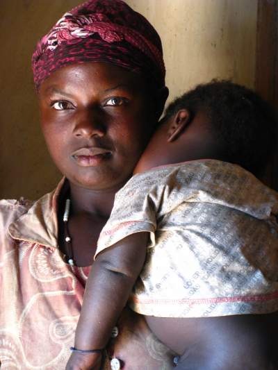 A Mukiga farmer and mother in Nyakiju, Muyumbu of southwestern Uganda is longing for the sound of rain again. (Photo credit: Trina Moyles)