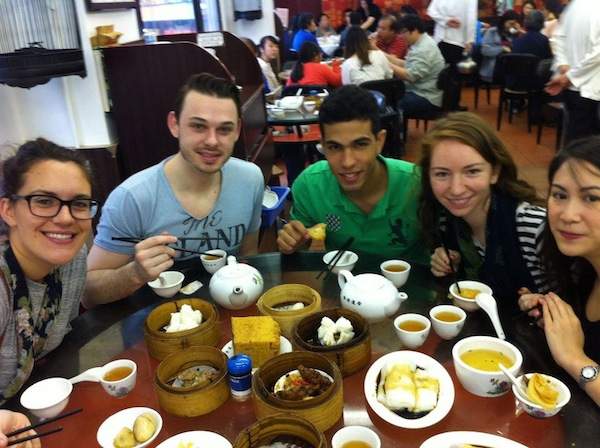 Monica and a group of friends share a dim sum meal in Hong Kong. 