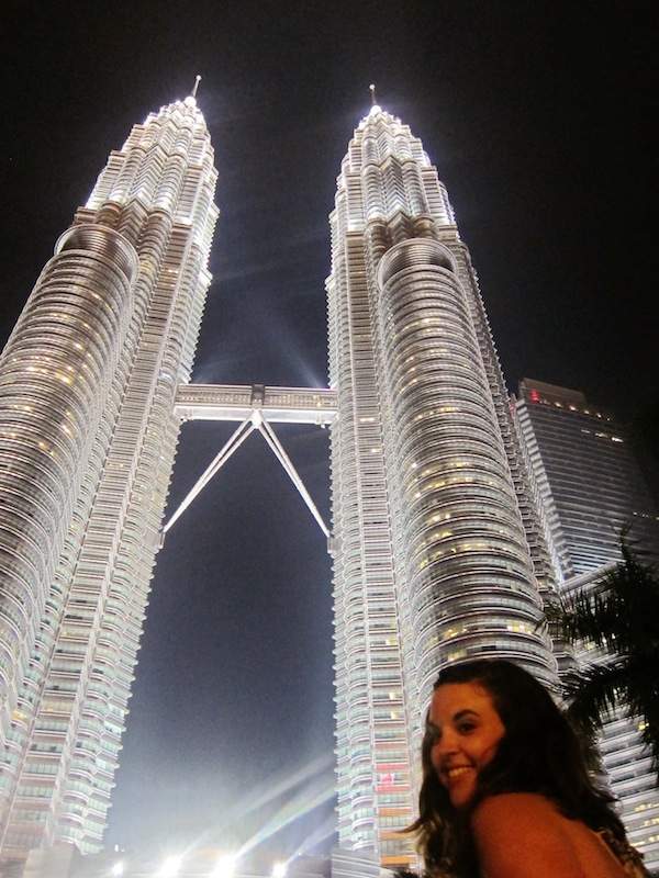Alana poses in front of Petronas Two Towers in Kuala Lumpur, Malaysia.