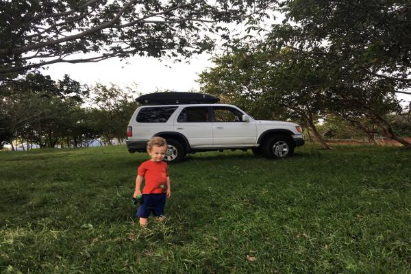 Aisling&#039;s son in front of &quot;Coco,&quot; the family car that made the journey to Costa Rica.