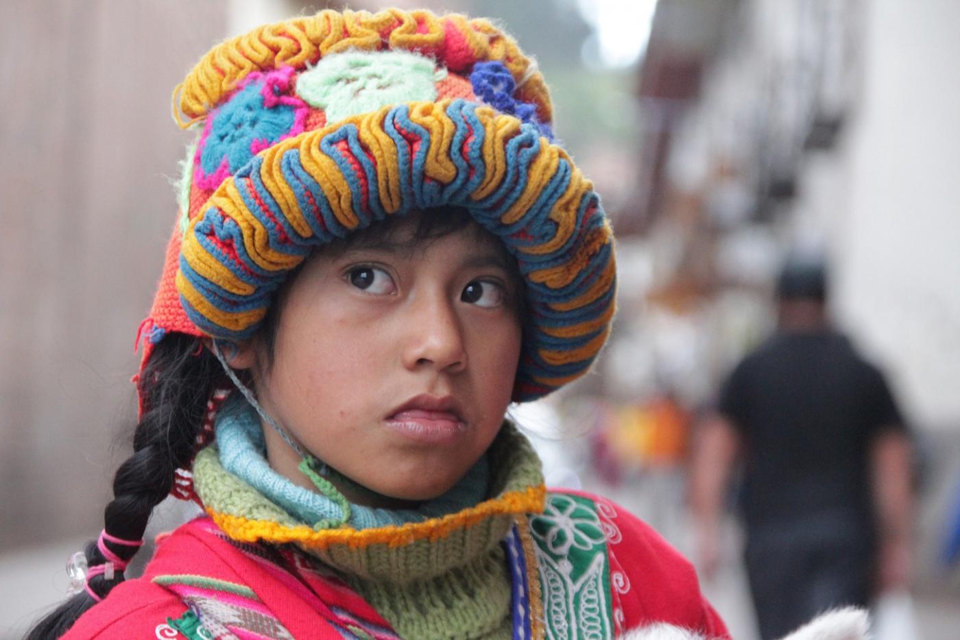 A young Peruvian girl in traditional dress.