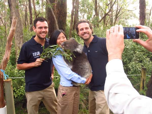 Greg Snell (left) poses with Best Jobs contestants &quot;CC&quot; Hseih and Nick Tilley at the Cleland Wildlife Park in South Australia.
