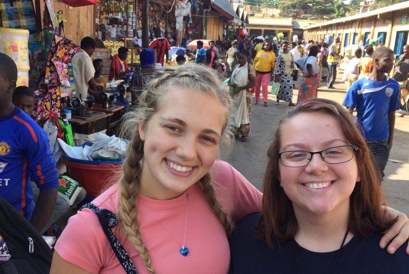 Lillian (right) and her friend Reagan visit a market in Rwanda. 