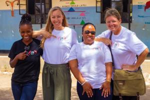 The writer, Joanna (right), poses with a volunteer and staff from Perfect Vision, a women's empowerment non-profit organization..