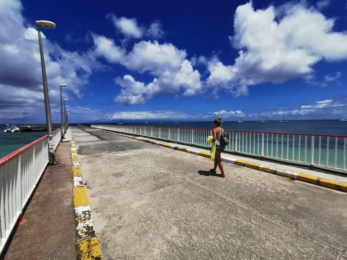 Emily strolls down the pier in Guadeloupe. 