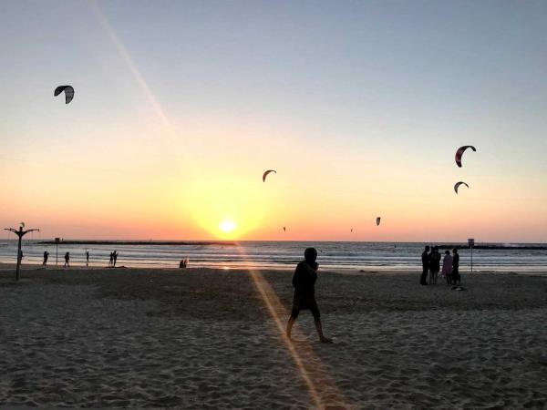 Windsurfers on Shabbat. Saturdays are the busiest time for Israel’s beaches; people of all ages come to enjoy the day off.  