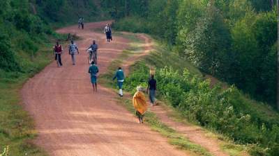 People on a village road in Uganda.