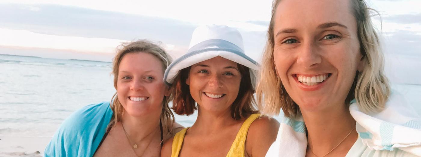 Kelly Iverson (centre) post-surgery with her sister and a friend.