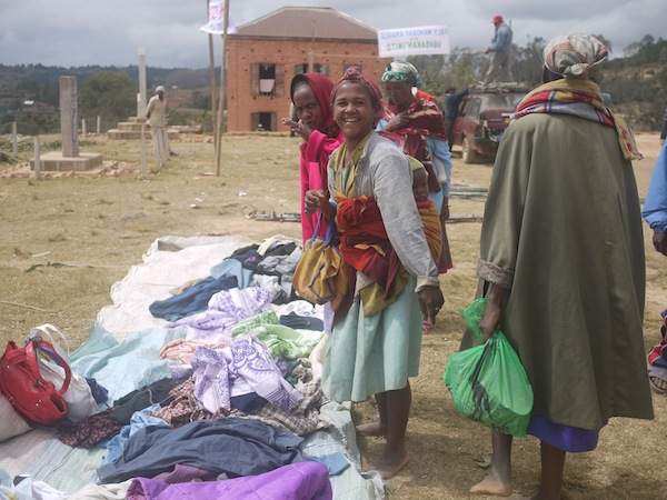 Women in Madagascar inspect the &quot;frip&quot; in a local market.