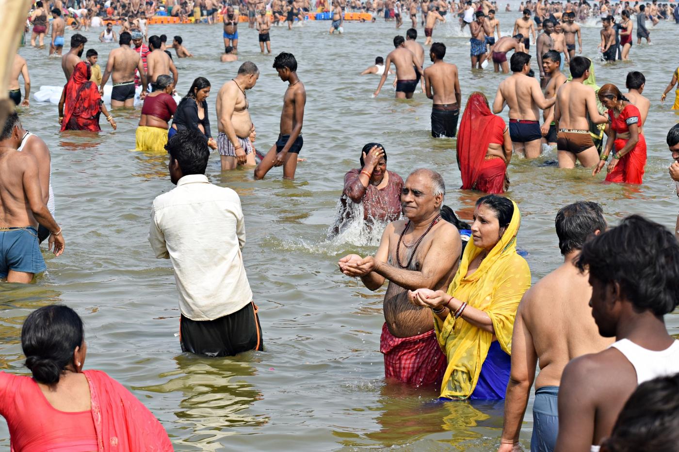 Hindu pilgrims bathe during Kumbh Mela.