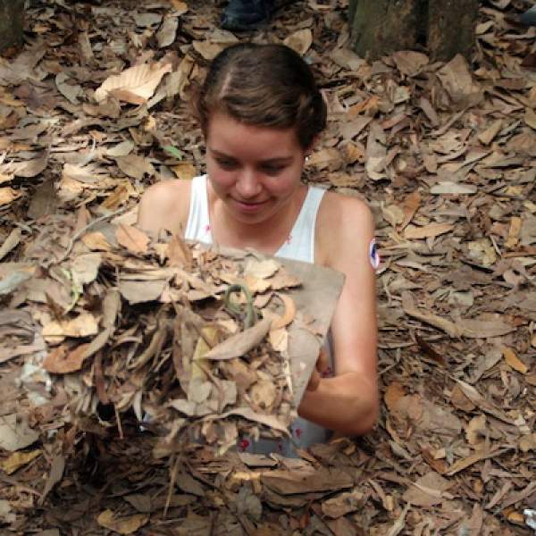 Judi enters the Cu Chi tunnels in Vietnam.