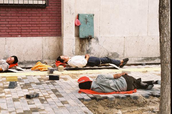 Chinese labourers napping at lunchtime.